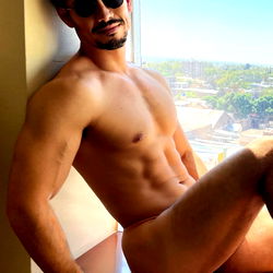 OnlyFans Model Pedro De León, Shirtless in Hotel Room with City View