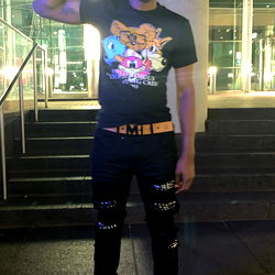 Young Man in Black Clothing Posing for a Selfie at Night