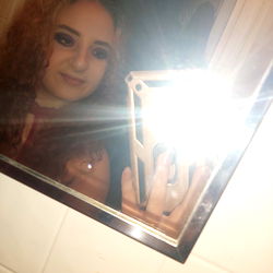 Cute Girl in Bathroom Mirror