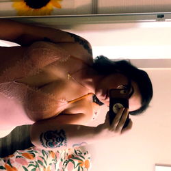 A Model Posing for a Photo in a Mirror