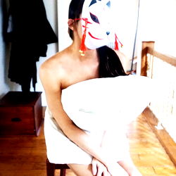 Fashionable AquaK in a Vibrant Room with a Mask