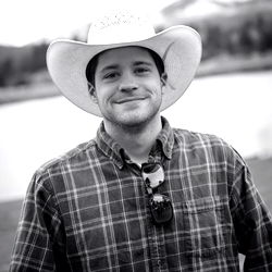 Smiling Man in Cowboy Hat and Shirt, Outdoors