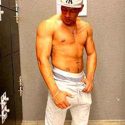 Fitness Model Adrián Pacheco Striking a Pose at the Gym