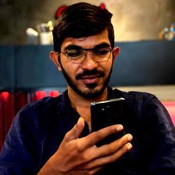 Antony Davis in Casual Attire Checking Phone