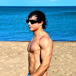 Fitness Model Alpha King on Beach Shoot