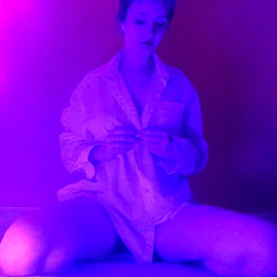 Midas, OnlyFans Model in a Captivating Pink Light