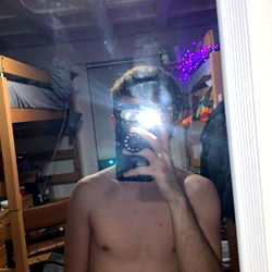 Austin's Shirtless Selfie in a Bedroom