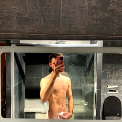 A Shirtless Selfie in a Bathroom