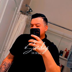 Adrian, 28 year old male fitness model posing in bathroom mirror