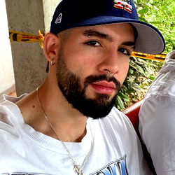 Young Male with Beard and Baseball Cap, Possibly From Medellín, Colombia