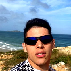 A Young Man Standing on a Beach