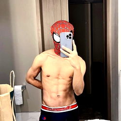 Aecham__ in a Spider-Man mask, showing off his physique