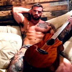 Jax, Muscular OnlyFans Model with Guitar