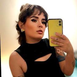 Stylish Arin, OnlyFans Model from Indio, CA, with Yellow iPhone and Tattoo