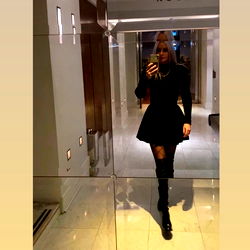 London Based Model Poses for Camera in Luxury Store's Mirror