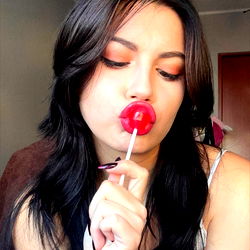 Lyra Emberlyn, OnlyFans Model, with Chocolate Candy