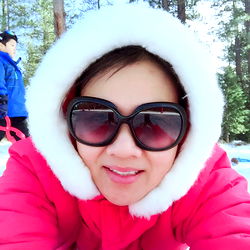 Woman in a Cozy Winter Coat Taking a Selfie