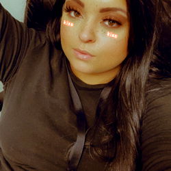 Stylish Female in Black Sweater with Red Earrings