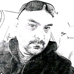 An Instagram-ready image of a stylish man posing for the camera.