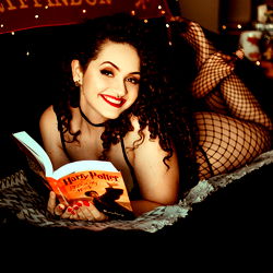 A Young Woman with a Book and Cat in the Background