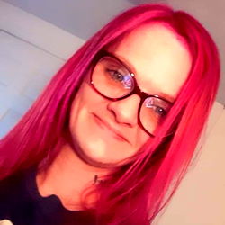 Stylish Woman with Red Hair and Pink Glitter