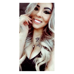 Anissa Nicole, a striking beauty posing confidently with her tongue playfully in her mouth.