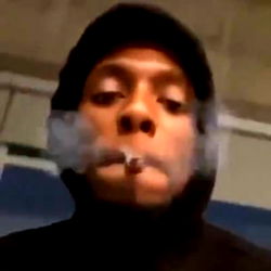 Rapper Gut Digger in Hoodie, Smoking