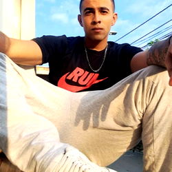 Model Sebastian's Strong Instagram Post: A Man Sitting on the Ground with a Cool Style!