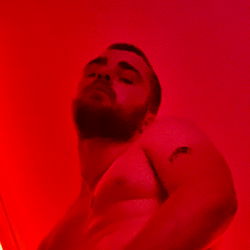 OnlyFans Model Ben in a Shirtless Selfie with Slightly Open Shirt