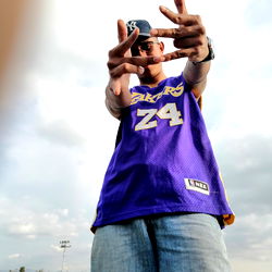 Aaron Hall, a young adult male, proudly posing with his finger signaling the number 24.