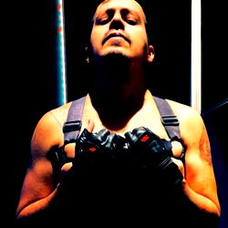 Muscular Male Model with a Vest and Gloves in Studio