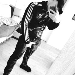 Casually Dressed Individual Taking Selfie