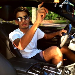 Ace in a Luxury Car, Making an Ominous Hand Signal