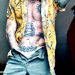 Tattooed Man in Floral Shirt on OnlyFans
