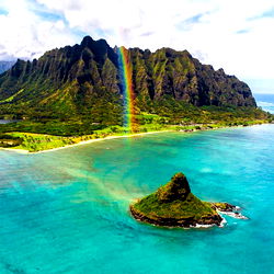 Breathtaking Hawaiian Scene with Rainbow and Lush Landscapes
