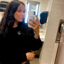 Chey, a social media influencer in a public restroom