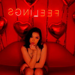 Bambii in a Red Velvet Room with a Catchy Sign Behind