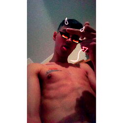 Model Alexblessd Poses for a Selfie