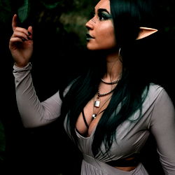 Elvish Female Character in a Dark Forest Setting