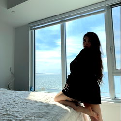 A Model in a Hotel Room with Ocean View