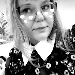 Woman in Floral Blouse Taking Selfie