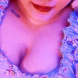 Lilianna in Pink Floral Blouse with Red Lipstick