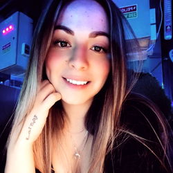 Young Woman with Tattoo Smiling
