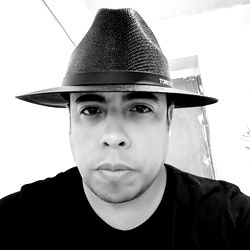 A man in a fedora hat, possibly from Monterrey, Mexico