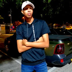 Angel Arias in a Dark Parking Lot