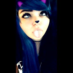 Kitten, A Female With Blue Hair and a Tattoo