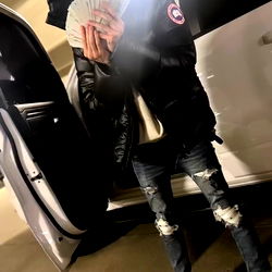 Ballianos in a Car with Cash in Hand