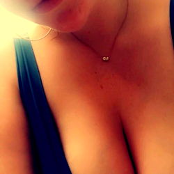 OnlyFans Model LilMiss33 Showcasing Her Enhanced Breasts