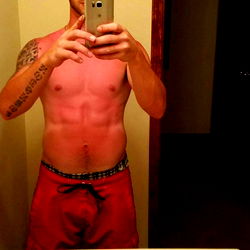 A Shirtless Man in a Bathroom