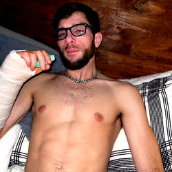 A man with a bandaged forearm